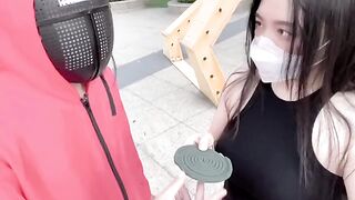A hot Chinese girl participates in a daring twist of the Squid Game challenge