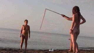 A girl is fucking on the public beach without any clothes