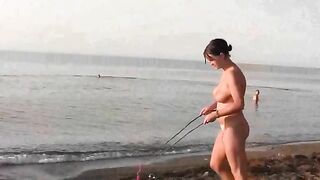 A girl is fucking on the public beach without any clothes