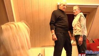 A bearded gray-haired man has sex with a young blonde