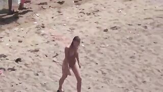 A pair of naked people are having fun on the sea