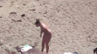 A pair of naked people are having fun on the sea