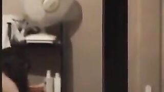 He admires to himself in the mirror, standing completely naked in front of him