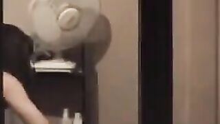 He admires to himself in the mirror, standing completely naked in front of him