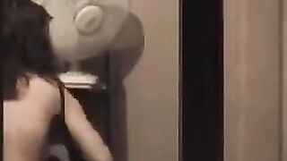 He admires to himself in the mirror, standing completely naked in front of him