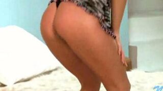 A young Russian beauty does a strip dance for the camera