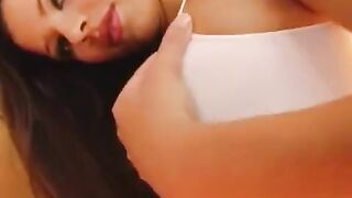 A girl plays with a dildo and shows her wet vagina in close-up