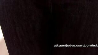 An aged woman runs her fingers over her old pussy