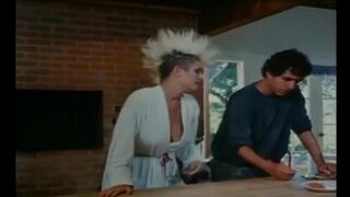 A group of girls fucked by guys in an intense retro-style orgy scene