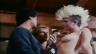 A group of girls fucked by guys in an intense retro-style orgy scene