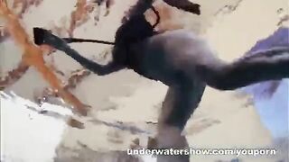 A naked girl is having fun in the swimming pool, capturing erotic moments underwater