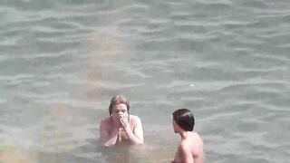 Bunch of naked girls bathing in the sea