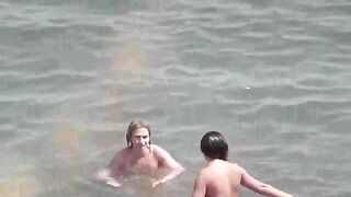 Bunch of naked girls bathing in the sea