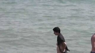 Bunch of naked girls bathing in the sea