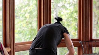 Vietnamese girl with a strapon penetrated the pussy of a naive virgin in the kitchen