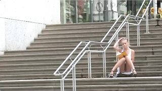 A sexy girl is walking without panties on the street