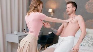 A couple has a gentle conversation while lying on the bed completely naked