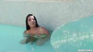 A girl is having swimming lessons in the pool