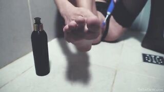A girl washes her shaved pussy in the shower and caresses it