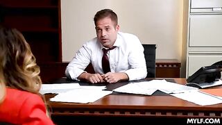 A busty MILF is getting fucked right in the office
