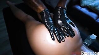 A hot chick massaging her hairy pussy with oil