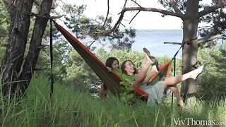 A girl gets a tan in a sensual lesbian encounter