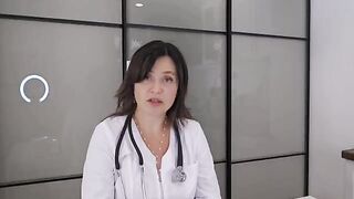 A girl with huge boobs is being examined by a doctor in this hot vid