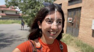 Girl sucks dick on the city streets and gets a cumshot