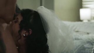 A brunette with a tattoo licks her boyfriend's cock on the bed