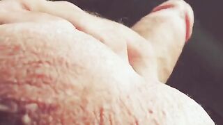 The hand moves up and down the barrel, moaning loudly