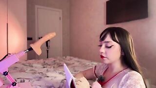 A girl with big boobs fucks a rubber dildo, emulating a sexologist