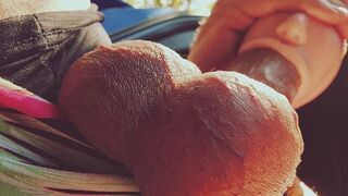 A girl with a silicone mouth works outdoors and moans