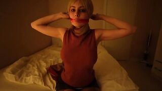 Girl plays a seductive role, teasing with her gaze