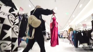Naughty girl fucks with a guy in the fitting room, almost caught